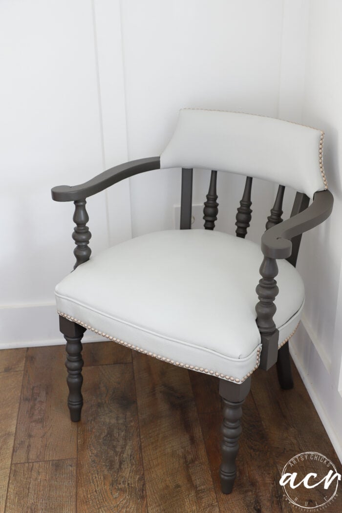 off white chair with brown trim