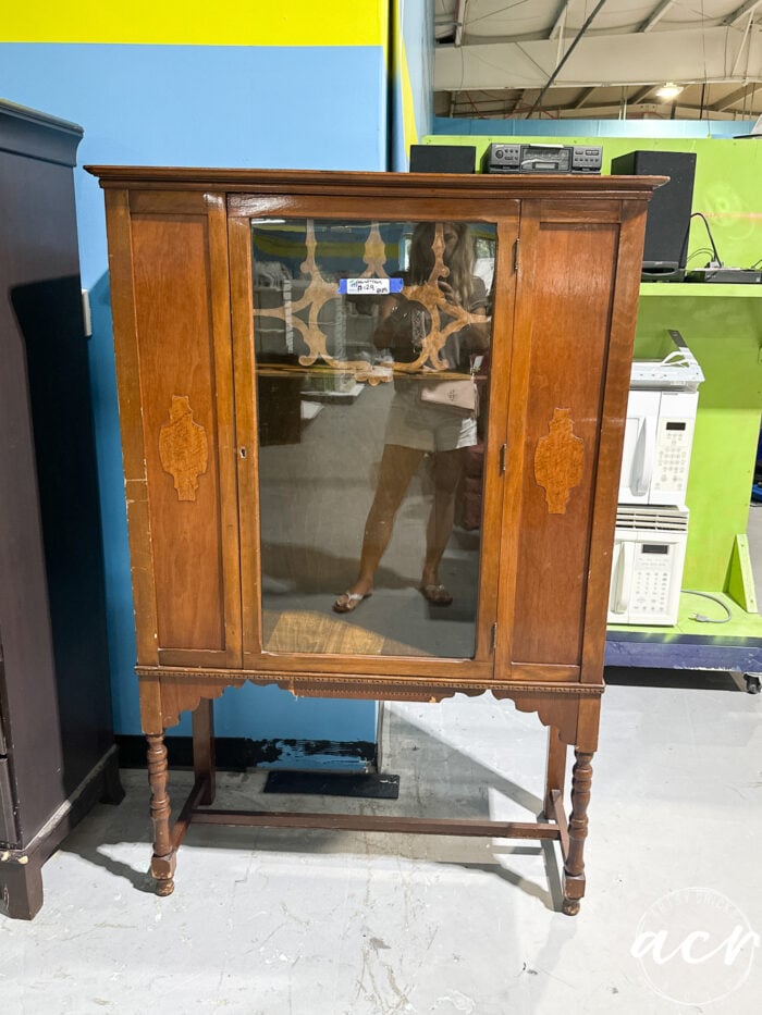antique wood cabinet with glass door