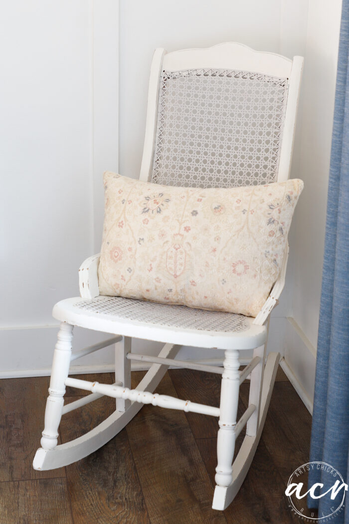 finished painted rocker with ivory floral pillow