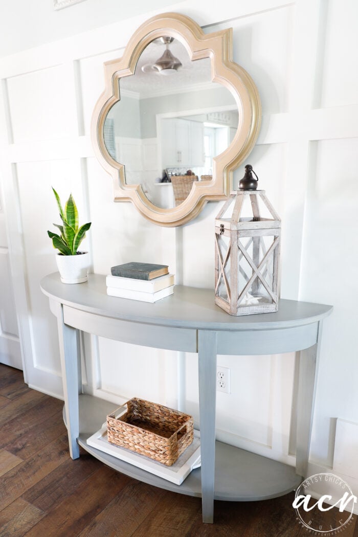 side view of console table styled with mirror above