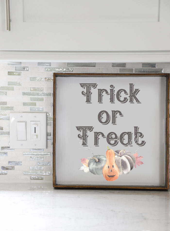 trick or treat with pumpkins sign
