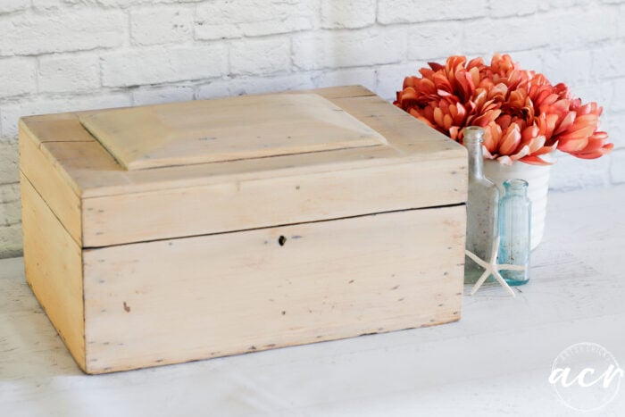 wood box from front with flowers beside