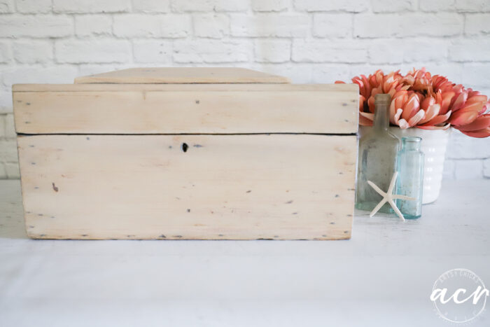 front of wood box with flowers