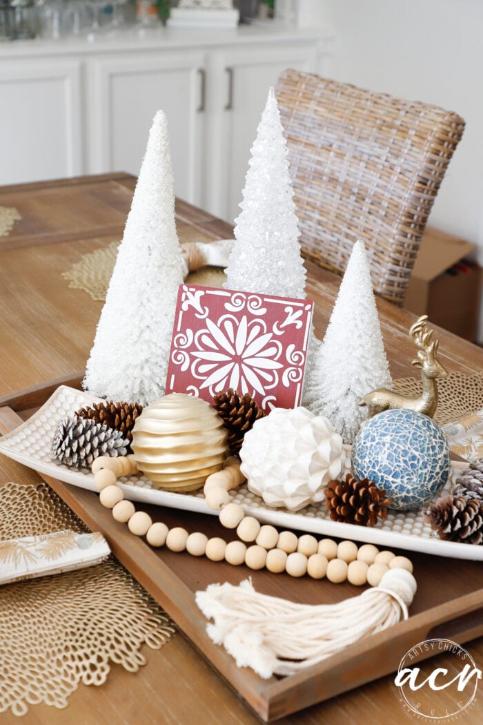 christmas trees and decor on dining table