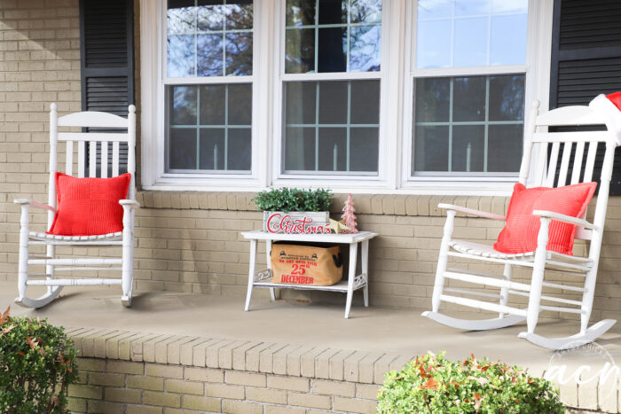 white rockers red pillows little table decorated for Christmas in the middle