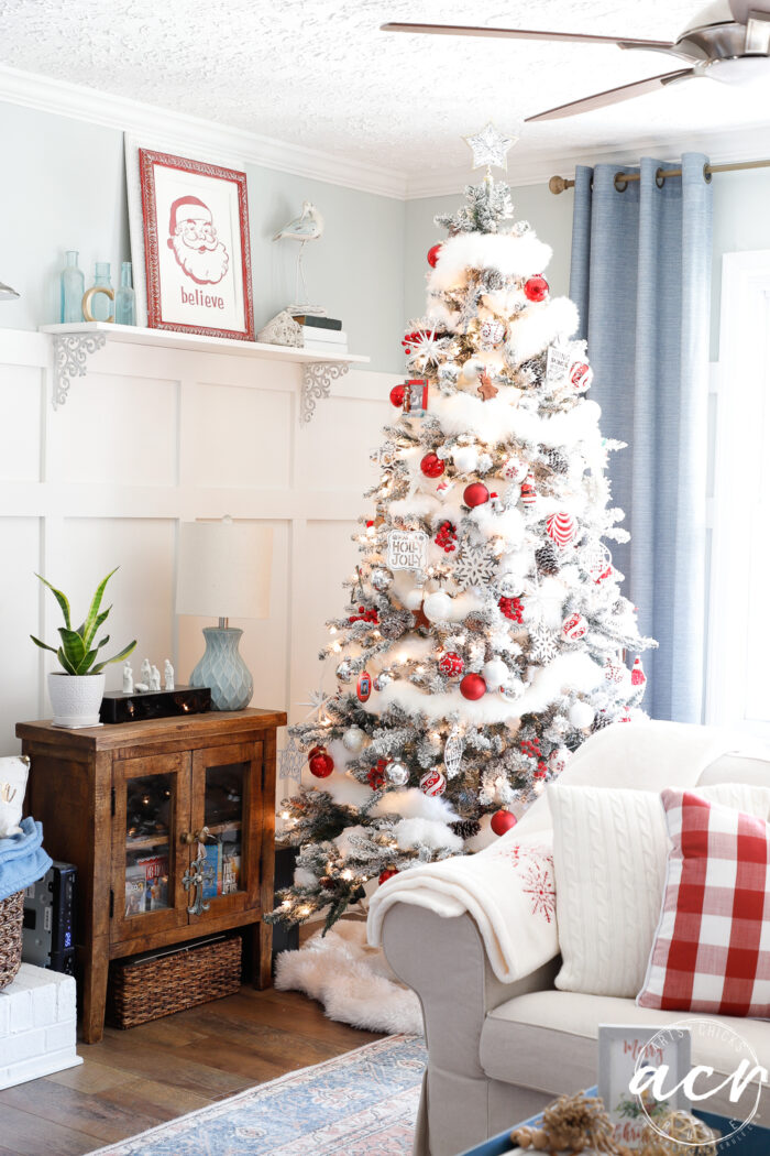 red and white tree with couch in living room