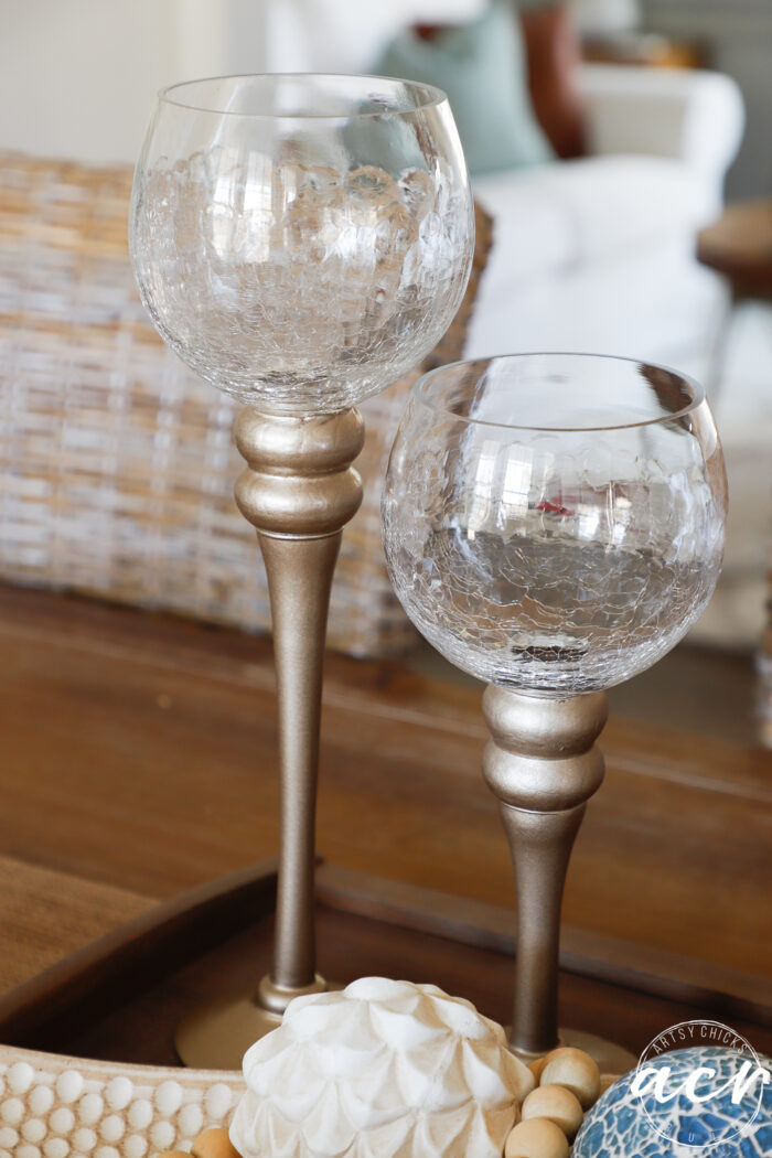 up close of glass candlesticks with gold stem bases
