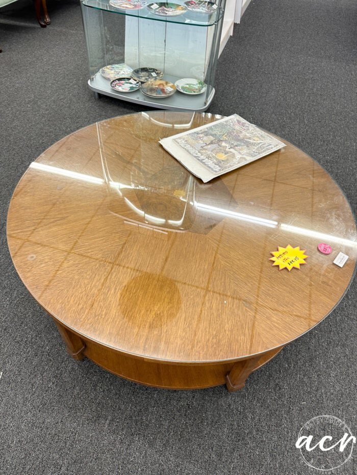 small round coffee table with glass top