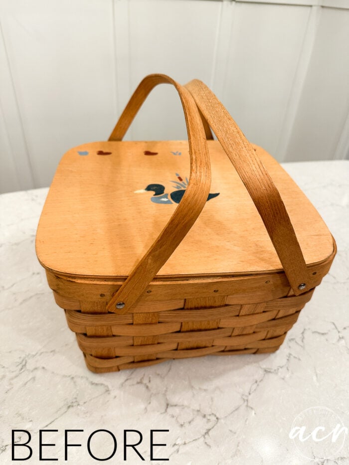 orange colored basket with ducks on top of lid