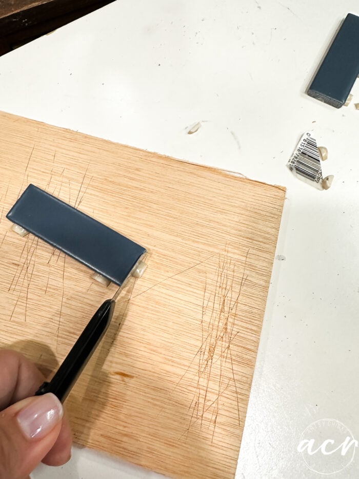cutting rubber backing from between tiles