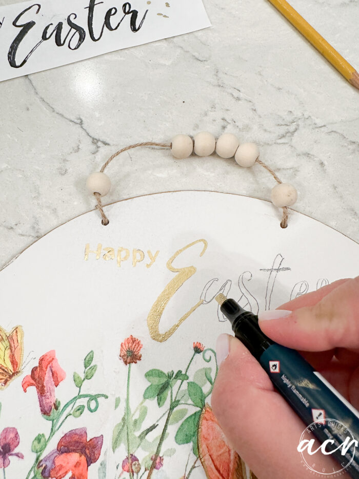 drawing in the happy easter with gilding marker