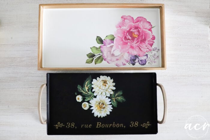white tray with gold edge and pink flowers, black tray with gold and white flowers