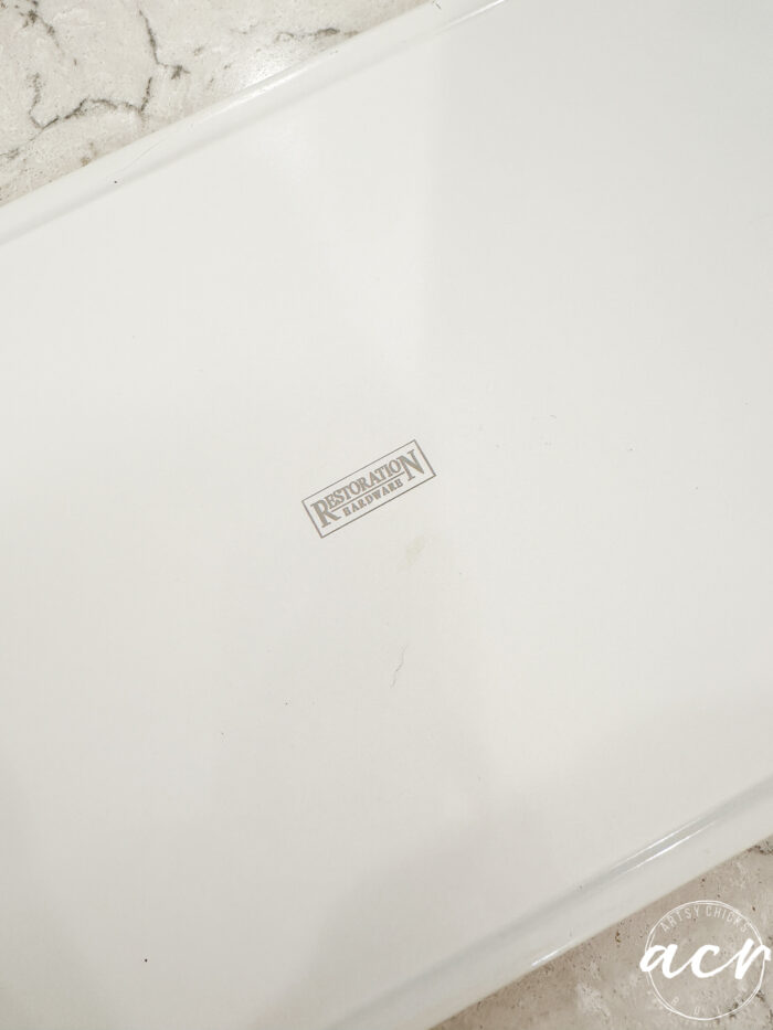 backside of white tray with restoration hardware stamp