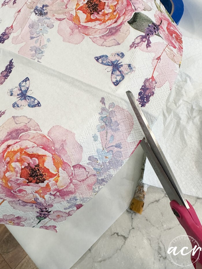 cutting out the floral napkin