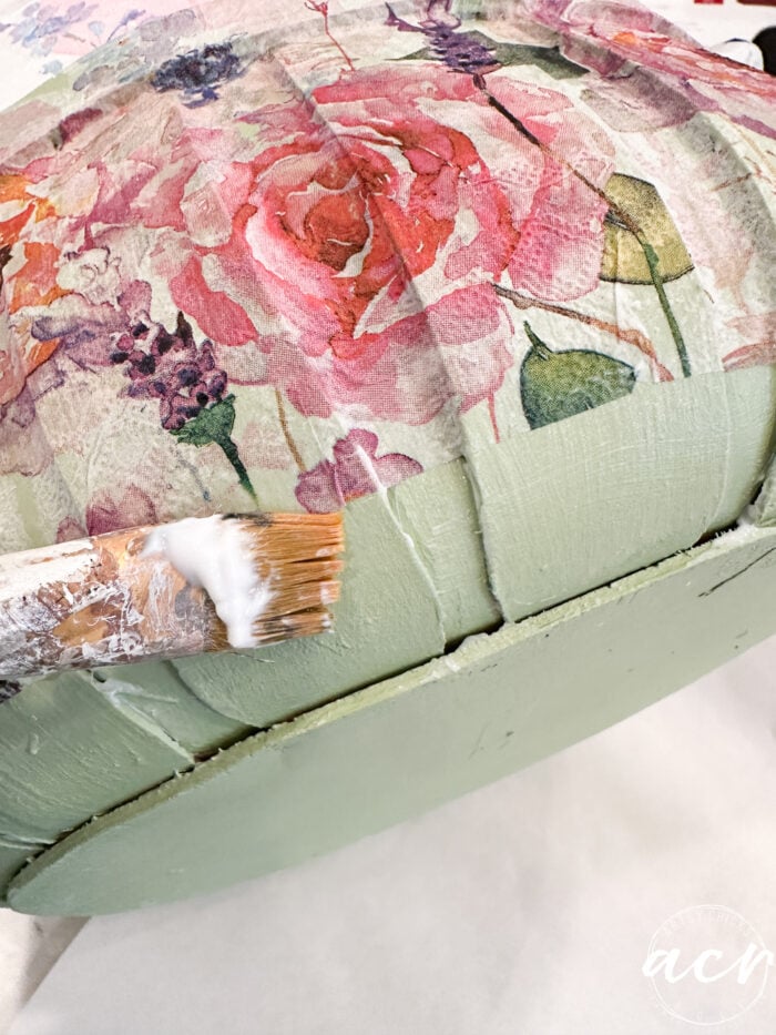 adding more napkin to the bottom of the basket