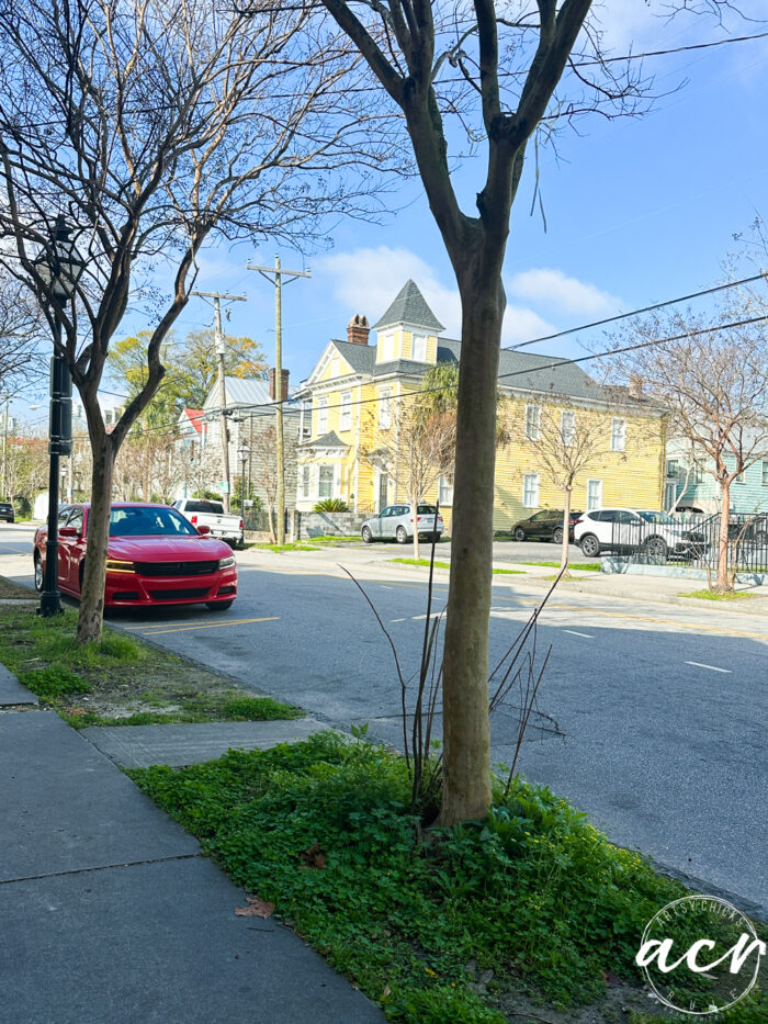yellow house on road in distance