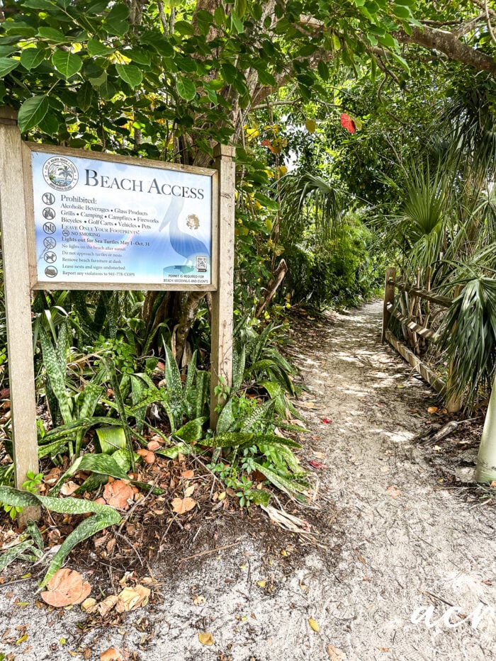 beach sign at entrance to walkway to beach