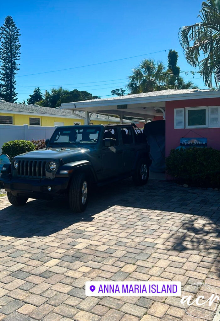 jeep in front of pink house