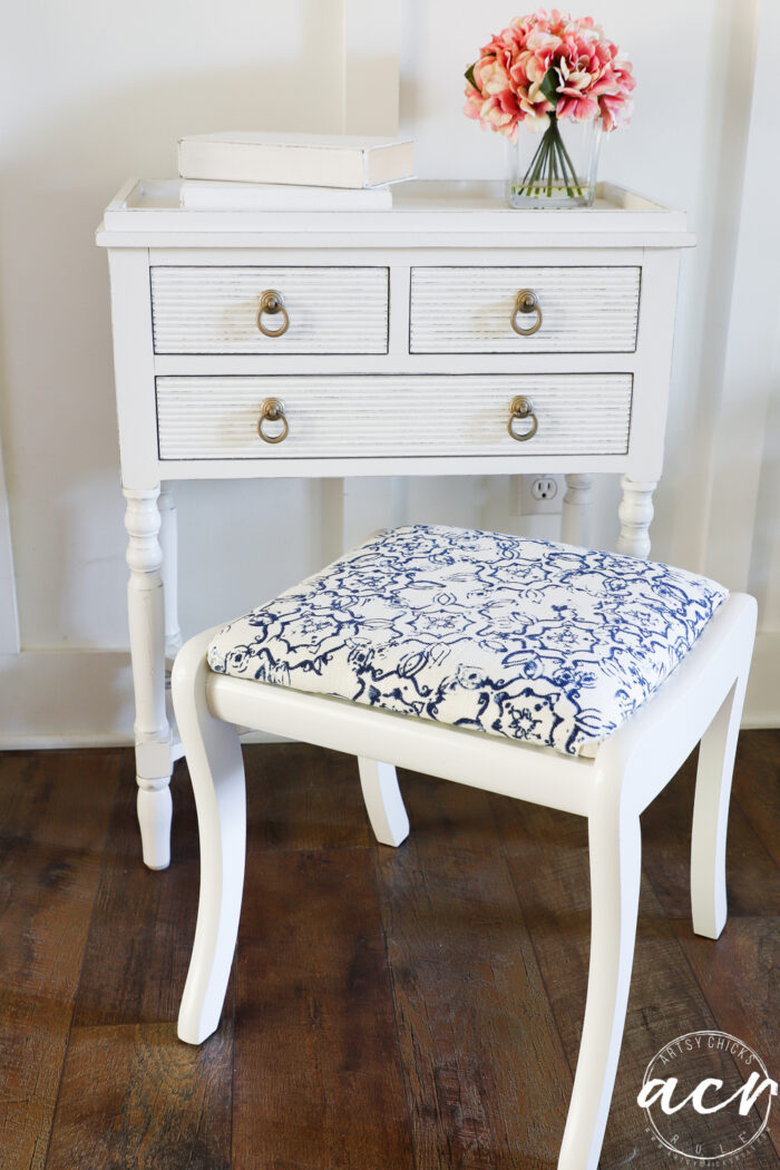 white cabinet with footstool