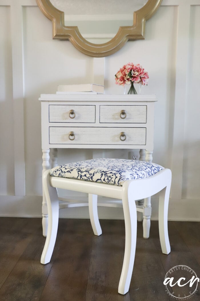 small white cabinet with drawers and white footstool