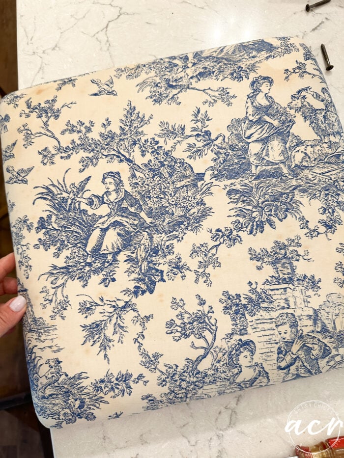 blue and white patterned fabric seat