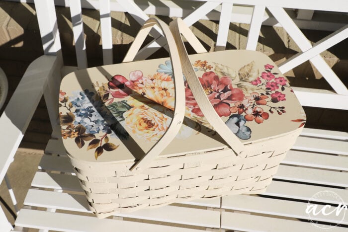 basket sitting on white porch on sunny porch