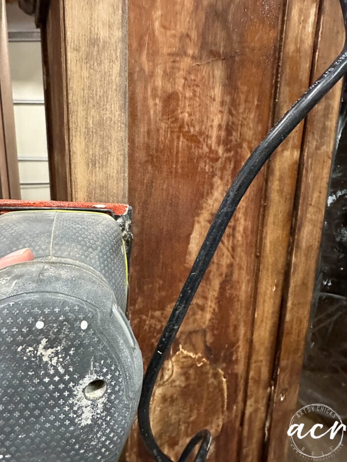 sanding the finish with sander