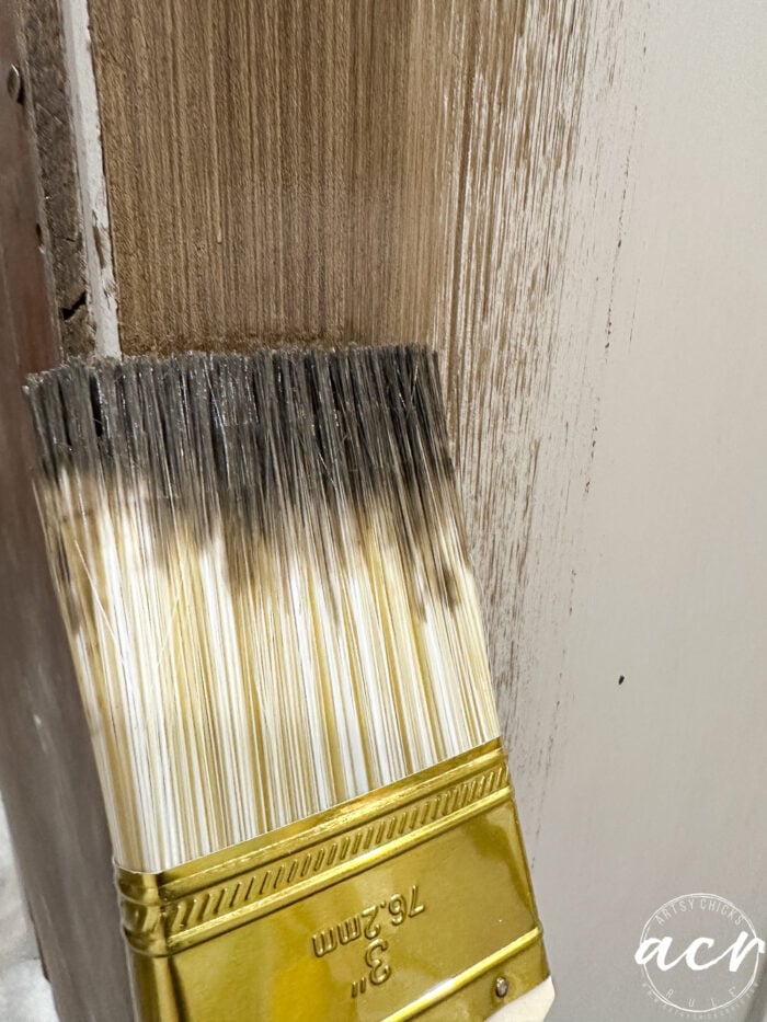 brushing the stain onto the painted wood