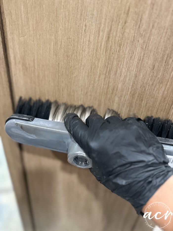 brushing the stain with the large brush