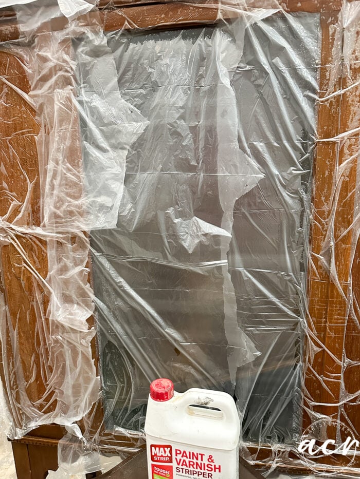 plastic wrap over stripper on cabinet
