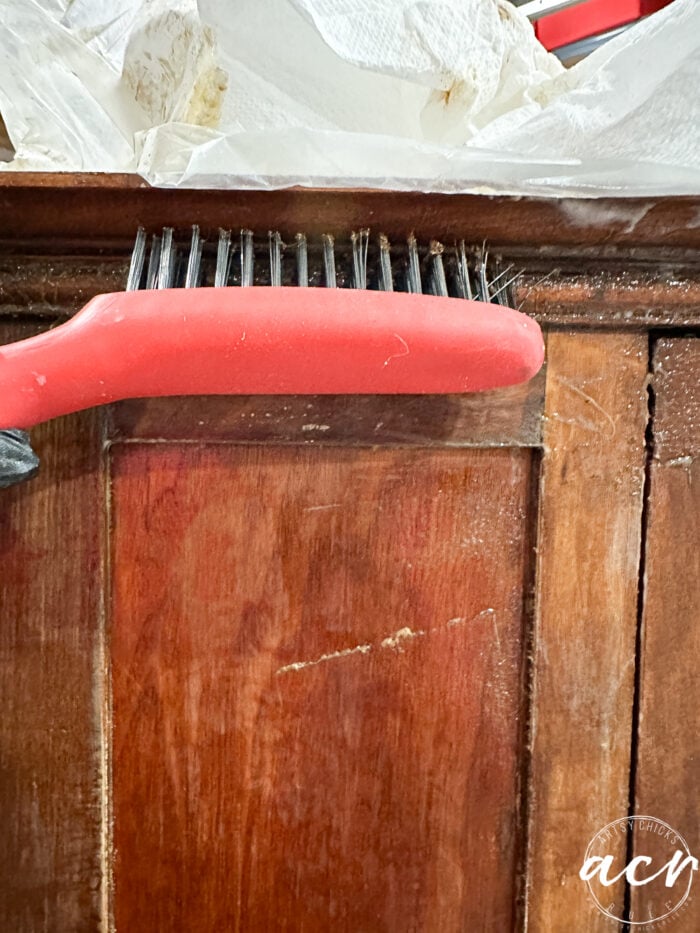 using a wire brush to get into the corners