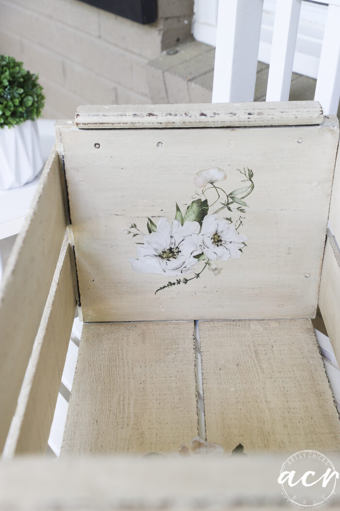 white flower transfer on inside of crate