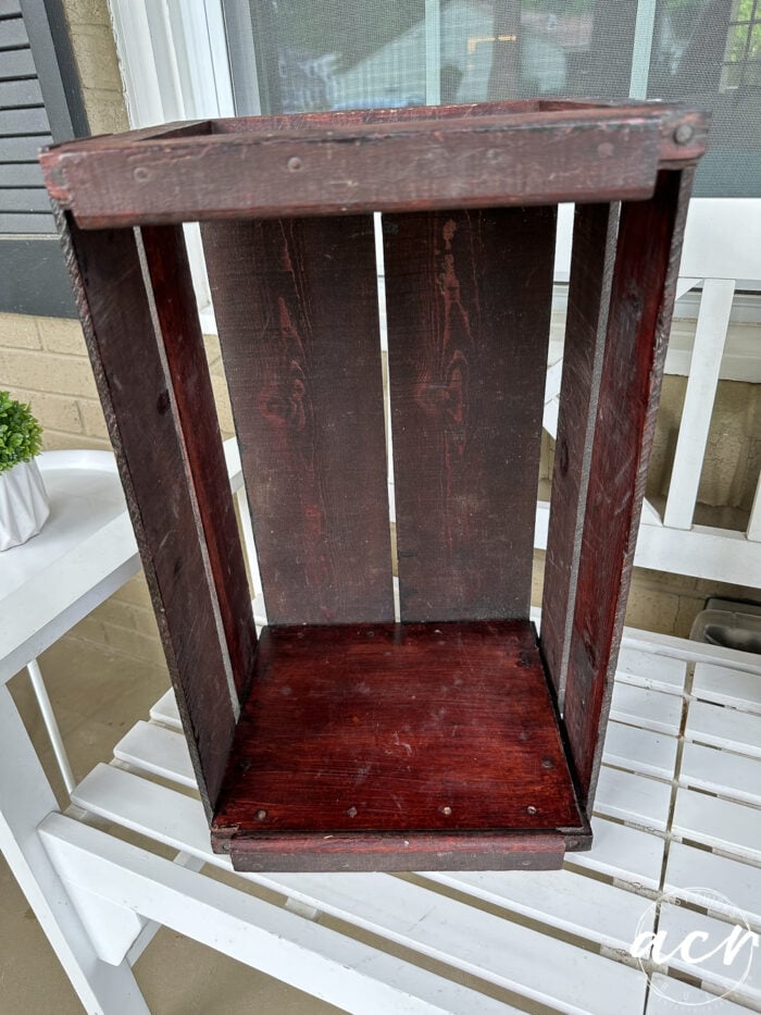 dark crate on white bench 