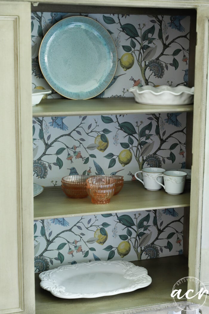 cabinet with pretty dishware inside