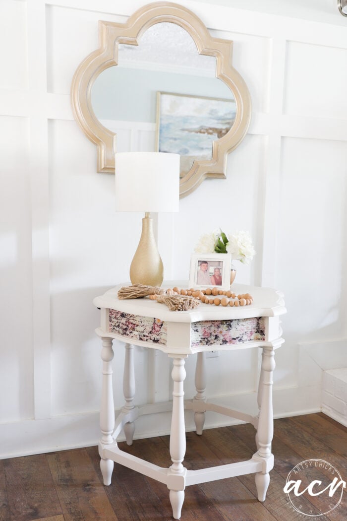 table styled with gold lamp photo and flowers