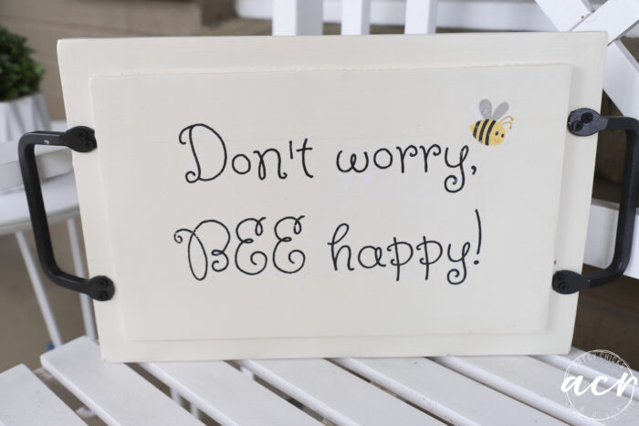 don't worry bee happy graphic on back of tray