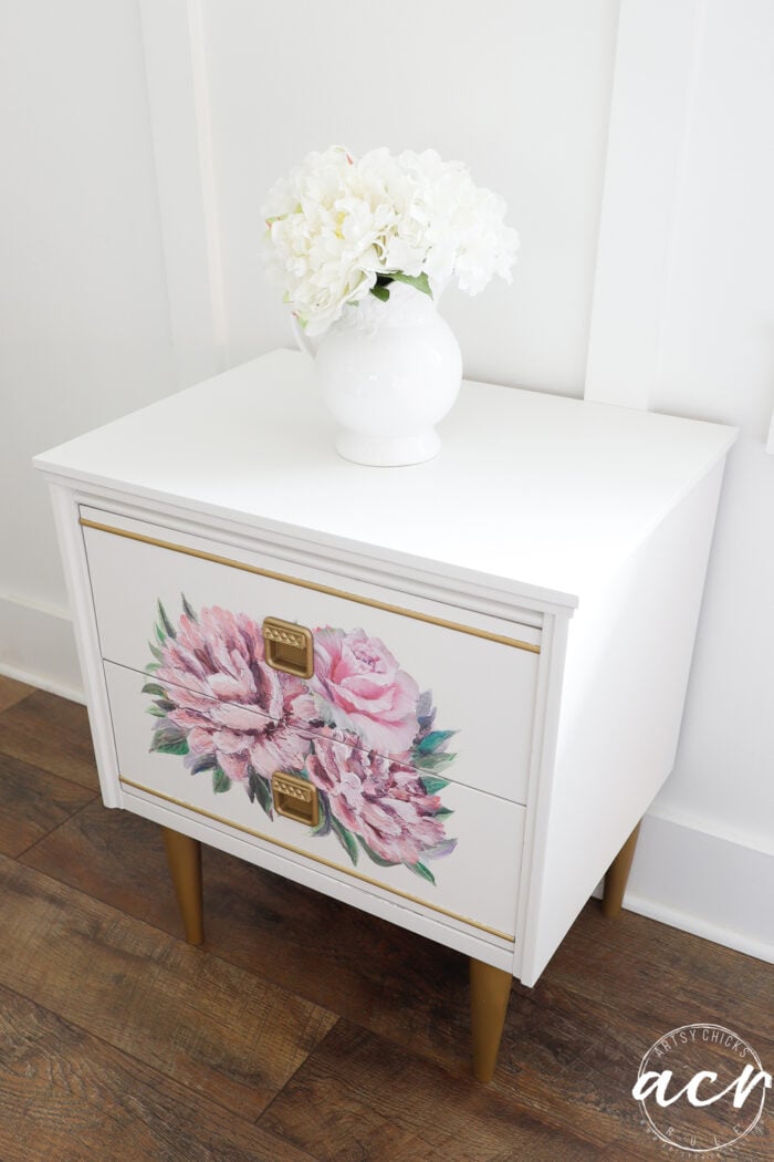 white nightstand with pink florals and gold trim