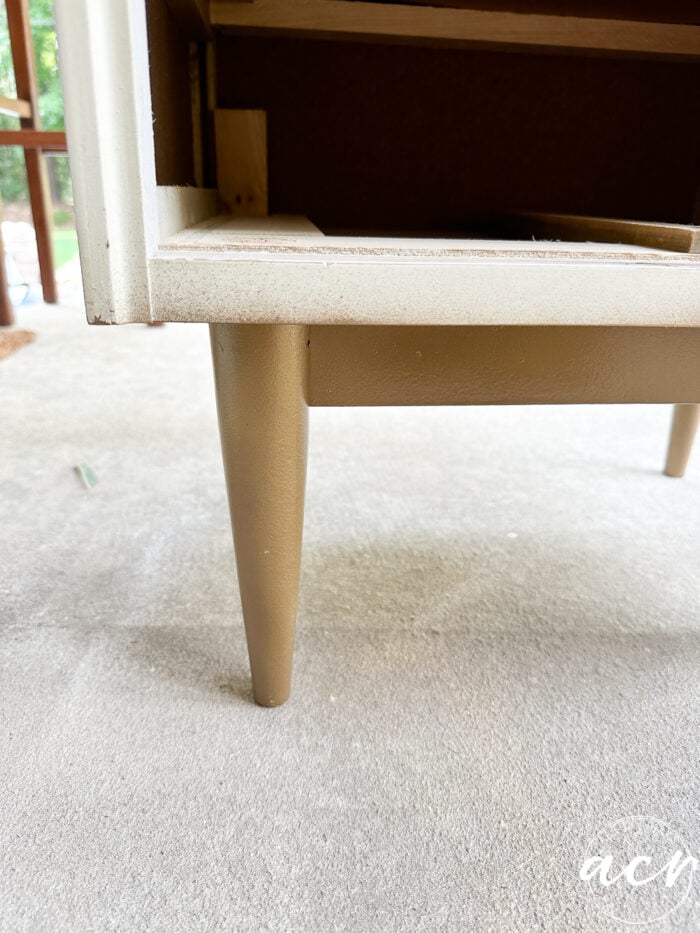 base of nightstand and legs painted gold
