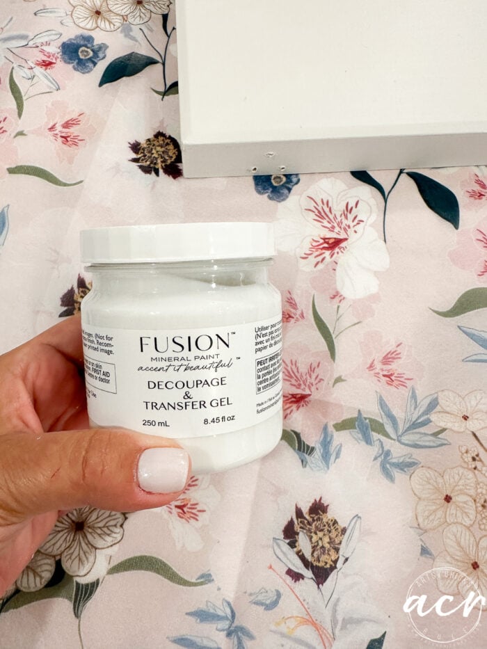 jar of transfer decoupage gel in hand