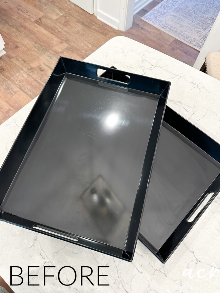 two black trays on counter