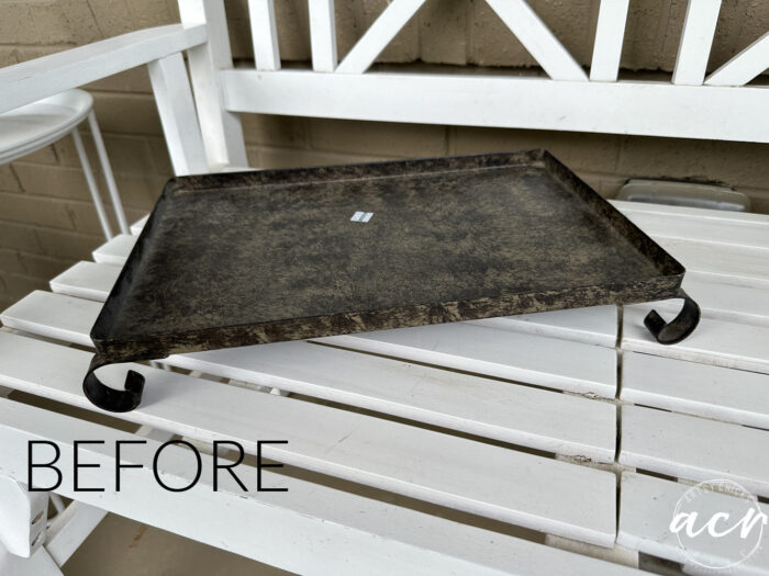 dark metal tray before on white bench