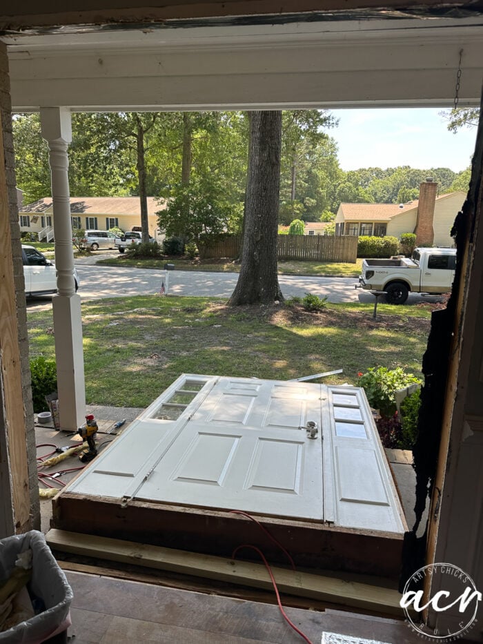 white front door laying down on porch