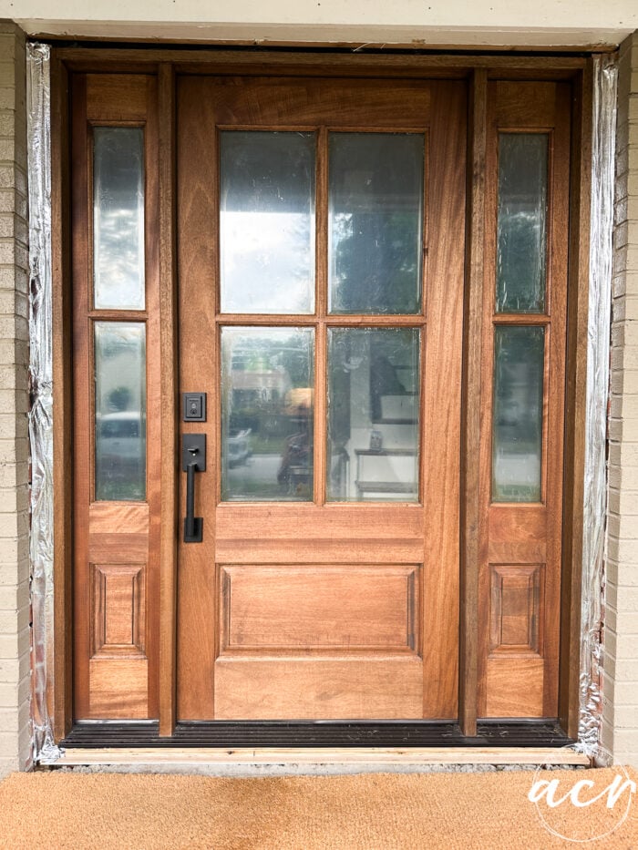 wood and glass front door installed