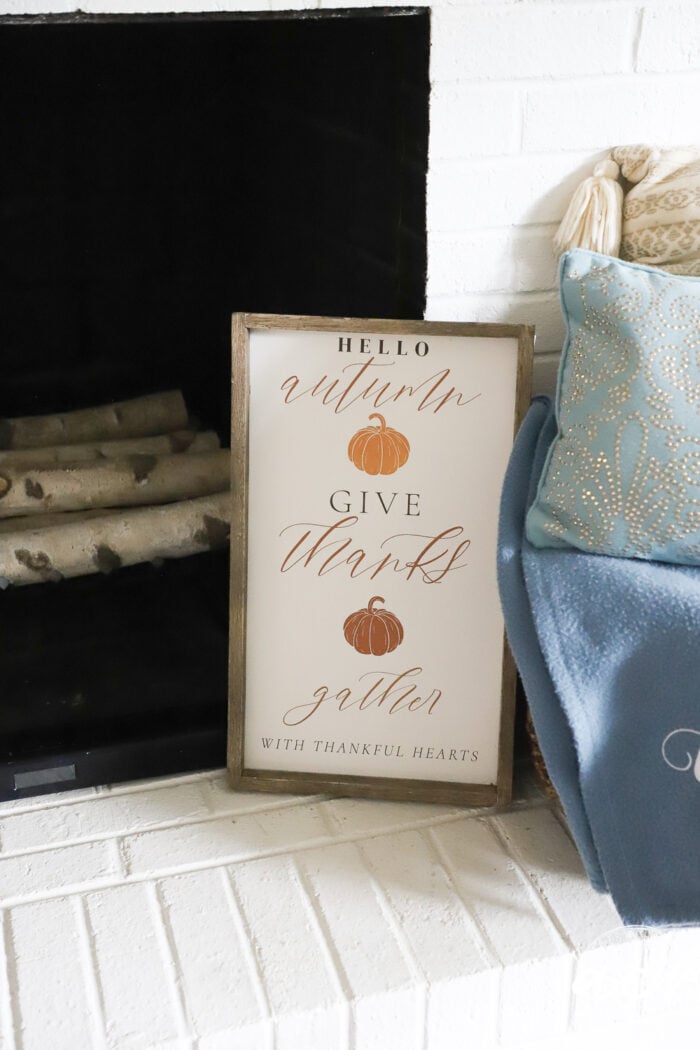 fall sign on fireplace surround