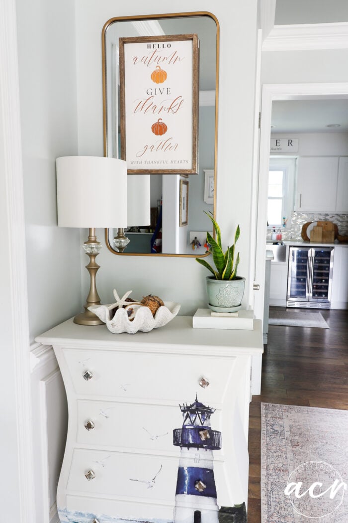 fall sign on mirror in foyer