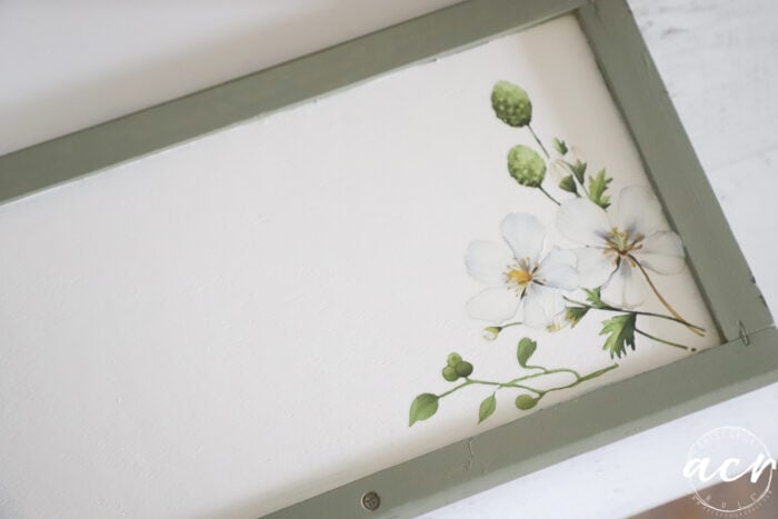 small flower and leaf transfer on inside of front door of bread box