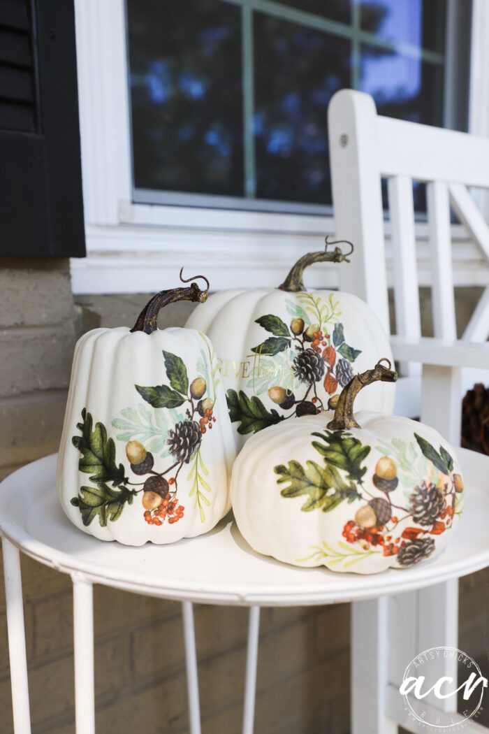 decoupage pumpkins on white table 