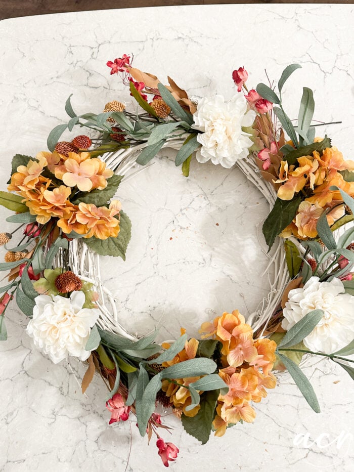 the wreath on the counter after the green leaves were added