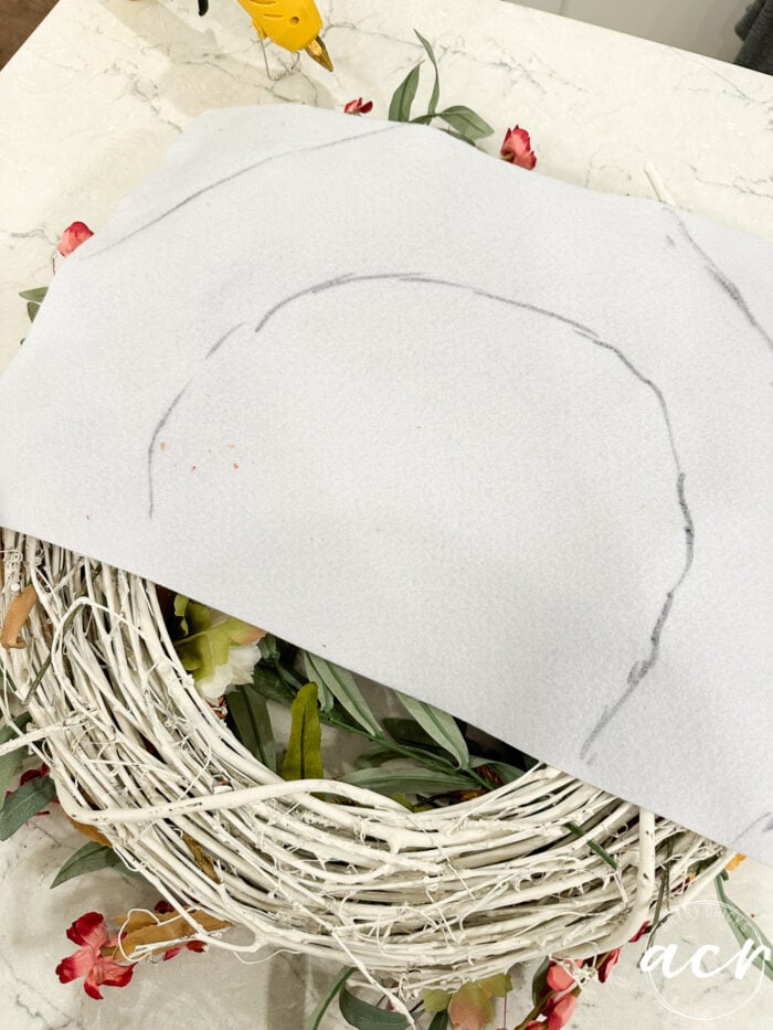 white felt laying over wreath with marks where to cut