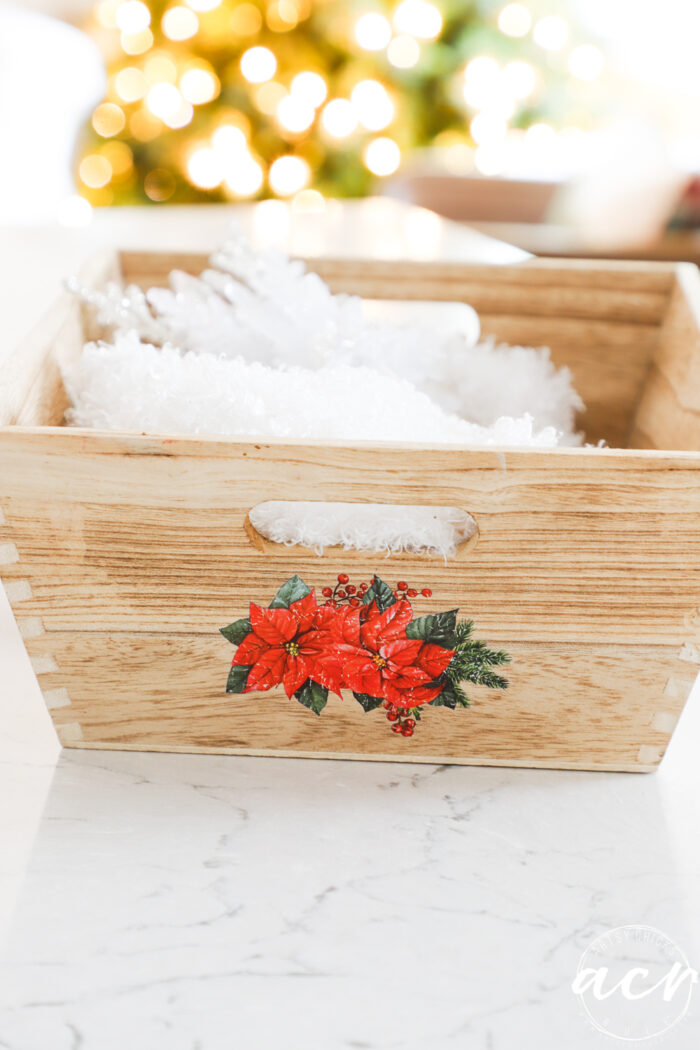 pointsettia and red berries in transfer on other side of wood tray